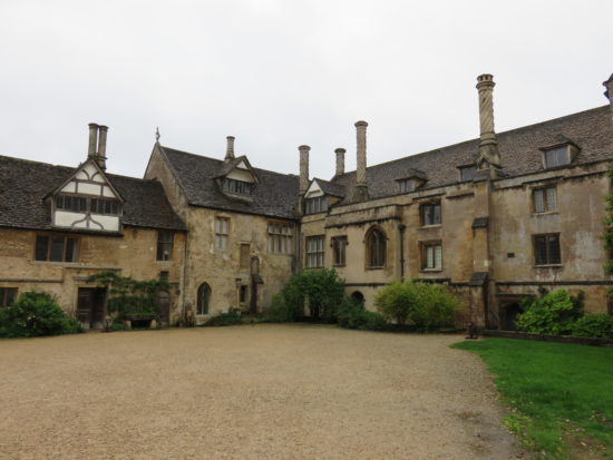 Lacock Abbey courtyard. Visiting the historic National Trust village of Lacock, Wiltshire, England