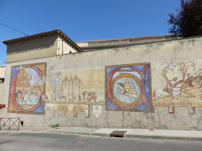 Artwork on Rue Trivalle. Day Trip to Carcassonne Medieval Citadel and Castle #france #francetravel #carcassonne