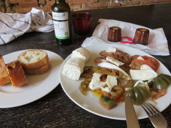 Our market food meal of buffalo mozzarella tomatoes, baguette, and canelés from Maison Pillon. What to see and do in Toulouse France #france #francetravel #toulouse