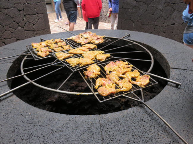 Chicken cooking over hot pit. Timanfaya National Park. Exploring the volcanic island of Lanzarote in the Canary Islands: 5 day itinerary #lanzarote #spain